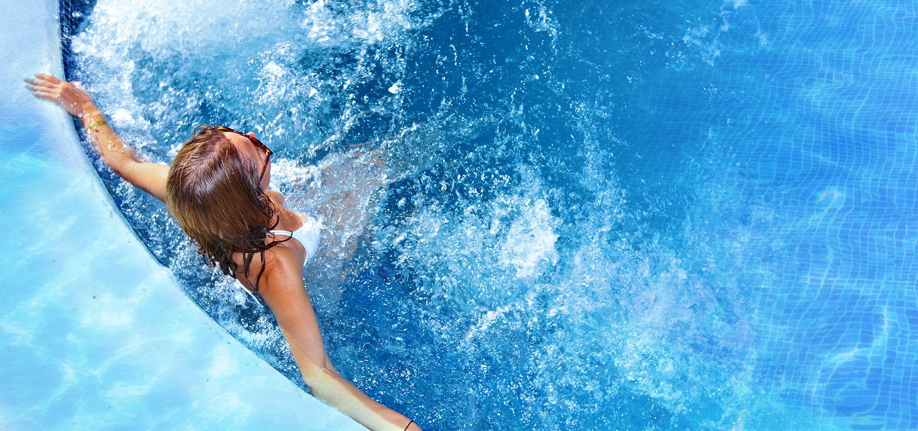 Resident relaxing in the swimming pool